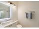 Modern bathroom features a vanity with an illuminated mirror and a walk-in shower at 4108 Roberts Point Rd, Sarasota, FL 34242