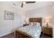 Inviting bedroom features wood floors, a ceiling fan, and nautical decor at 4108 Roberts Point Rd, Sarasota, FL 34242