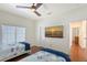 Relaxing bedroom features two twin beds and a flat screen tv at 4108 Roberts Point Rd, Sarasota, FL 34242