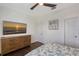 Comfortable bedroom boasts wood floors, a flat screen tv, and nautical decor at 4108 Roberts Point Rd, Sarasota, FL 34242