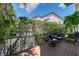 Cozy deck with comfortable seating and views of tropical foliage, creating a relaxing outdoor space at 4108 Roberts Point Rd, Sarasota, FL 34242