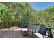 Charming outdoor deck with seating and lush greenery, ideal for enjoying peaceful moments at 4108 Roberts Point Rd, Sarasota, FL 34242