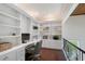 Dedicated home office with custom built-in bookshelves and a modern desk setup at 4108 Roberts Point Rd, Sarasota, FL 34242