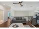 Relaxing living room features wood floors and a comfortable gray sofa at 4108 Roberts Point Rd, Sarasota, FL 34242