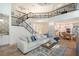 Spacious living room featuring high ceilings, wrought iron railings, and an open layout at 4108 Roberts Point Rd, Sarasota, FL 34242