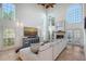 Spacious living room with fireplace, lots of natural light and tile flooring at 4108 Roberts Point Rd, Sarasota, FL 34242