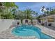 Relaxing backyard pool with lush landscaping, lounge chairs, and ample privacy at 4108 Roberts Point Rd, Sarasota, FL 34242