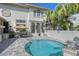 Beautiful backyard pool area with ample seating and lush tropical landscaping at 4108 Roberts Point Rd, Sarasota, FL 34242