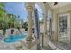 Inviting pool area featuring elegant columns and archways offering a serene outdoor retreat at 4108 Roberts Point Rd, Sarasota, FL 34242
