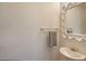 Cozy powder room with an ornate mirror and a stylish gold faucet over a pedestal sink at 4108 Roberts Point Rd, Sarasota, FL 34242