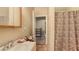 Small bathroom features a sink and shower with a zebra patterned curtain and tile floors at 4122 Old Bradenton Rd, Sarasota, FL 34234