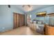 This bedroom shows light blue walls, wood floors, curtains, a window and a vintage dresser at 4122 Old Bradenton Rd, Sarasota, FL 34234