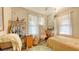 Bedroom features natural light, wardrobe rack, and desk at 4122 Old Bradenton Rd, Sarasota, FL 34234