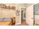 Bedroom includes coat rack and view to another room at 4122 Old Bradenton Rd, Sarasota, FL 34234
