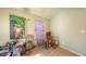 This bedroom includes wood floors, olive green walls, and needs updating at 4122 Old Bradenton Rd, Sarasota, FL 34234