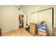 This bedroom includes wood floors, olive green walls, and needs updating at 4122 Old Bradenton Rd, Sarasota, FL 34234