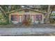 Charming bungalow with vibrant trim, a well-kept lawn, and offering a classic residential appeal at 4122 Old Bradenton Rd, Sarasota, FL 34234