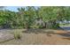 Charming two-story home surrounded by lush trees and shrubs, offering a serene and private setting at 4122 Old Bradenton Rd, Sarasota, FL 34234