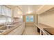 Bright kitchen featuring tile floors and ample counter and cabinet space at 4122 Old Bradenton Rd, Sarasota, FL 34234