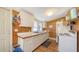 Well-lit kitchen features white cabinets and appliances at 4122 Old Bradenton Rd, Sarasota, FL 34234