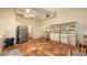 Eat-in kitchen with terracotta floors, ample storage, and lots of sunlight at 4122 Old Bradenton Rd, Sarasota, FL 34234