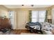 Inviting living room features hardwood floors and natural light from the large windows at 4122 Old Bradenton Rd, Sarasota, FL 34234