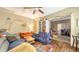 Comfortable living area with couches, ceiling fan, and an open floor plan at 4122 Old Bradenton Rd, Sarasota, FL 34234