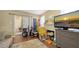Living room with fireplace, TV, open access to other rooms, and a window at 4122 Old Bradenton Rd, Sarasota, FL 34234