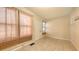 Cozy living room featuring tiled floors, natural light, and neutral tones to create a warm atmosphere at 4122 Old Bradenton Rd, Sarasota, FL 34234