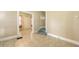 Neutral room with tiled floor, small staircase and doorway leading to another room at 4122 Old Bradenton Rd, Sarasota, FL 34234
