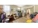 Bright living room with fireplace, TV, and open access to other rooms at 4122 Old Bradenton Rd, Sarasota, FL 34234