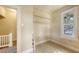 Bright room with a window, tiled flooring, and shelving at 4122 Old Bradenton Rd, Sarasota, FL 34234