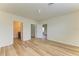 A large empty bedroom featuring wood floors, two closets, and an attached bathroom at 4206 Park Willow Ave, Palmetto, FL 34221