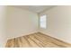 A spare empty bedroom with wood floors, a bright window, and neutral walls at 4206 Park Willow Ave, Palmetto, FL 34221