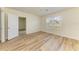 An empty bedroom featuring wood floors, a bright window, and an attached bathroom at 4206 Park Willow Ave, Palmetto, FL 34221