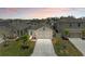 Aerial view of a single Gathering home featuring a manicured lawn, driveway, and neutral color palette at 4206 Park Willow Ave, Palmetto, FL 34221