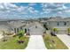 Charming one-story home with a well-manicured lawn, lush landscaping, and an attached two-car garage at 4206 Park Willow Ave, Palmetto, FL 34221