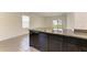Kitchen island featuring a granite countertop and stainless steel sink, perfect for meal prep at 4206 Park Willow Ave, Palmetto, FL 34221