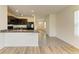 Bright kitchen featuring dark wood cabinets, granite countertops and stainless steel appliances at 4206 Park Willow Ave, Palmetto, FL 34221