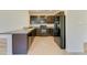 Kitchen featuring dark cabinets, granite countertops, and stainless steel appliances at 4206 Park Willow Ave, Palmetto, FL 34221
