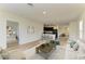 Cozy living room open to the kitchen, featuring a plush sofa and modern decor at 4206 Park Willow Ave, Palmetto, FL 34221