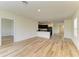 Expansive living area with open sightlines to the kitchen, blending style and functionality with durable floors at 4206 Park Willow Ave, Palmetto, FL 34221