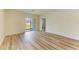 Open floor plan with wood flooring and sliding glass doors, great for indoor-outdoor living at 4206 Park Willow Ave, Palmetto, FL 34221