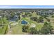 Wide aerial shot of the golf course surrounded by trees, water features, and manicured fairways showcasing course at 4570 Pinebrook Cir # 508, Bradenton, FL 34209