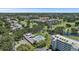 An aerial view shows the condo community with pools, golf course, and beautiful landscaping at 4570 Pinebrook Cir # 508, Bradenton, FL 34209