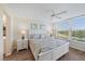 This bedroom offers natural light, a ceiling fan and stunning golf course views at 4570 Pinebrook Cir # 508, Bradenton, FL 34209