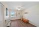 Well-lit bedroom with hardwood floors, a ceiling fan, and a large window bringing in plenty of natural light at 4570 Pinebrook Cir # 508, Bradenton, FL 34209