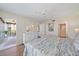 Bedroom with ensuite bathroom, large windows, and access to the balcony at 4570 Pinebrook Cir # 508, Bradenton, FL 34209