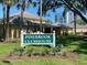 The Pinebrook Clubhouse features manicured landscaping and ample parking for guests at 4570 Pinebrook Cir # 508, Bradenton, FL 34209