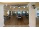 An inviting room with tables, chairs, and a beautiful hardwood floor, perfect for hosting gatherings at 4570 Pinebrook Cir # 508, Bradenton, FL 34209